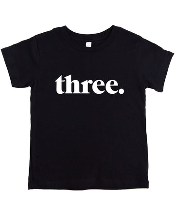 Black toddler shirt with minimalist "Three." text design for 3rd birthday