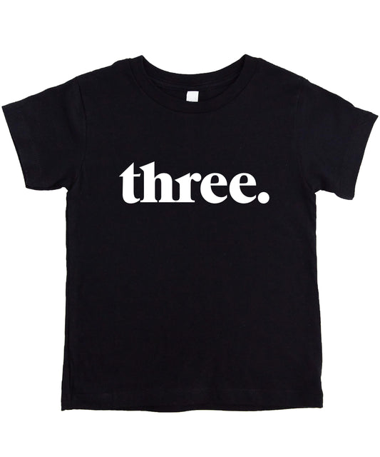 Black toddler shirt with minimalist "Three." text design for 3rd birthday