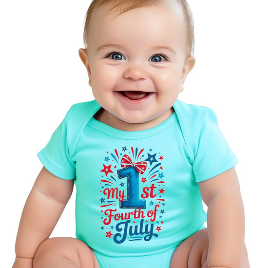 Baby bodysuit flat lay displaying full patriotic design with fireworks bursts and striped bow accent
