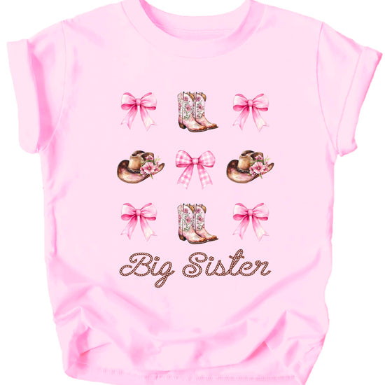 Close-up view of western big sister graphic featuring cowgirl boots and pink bow details