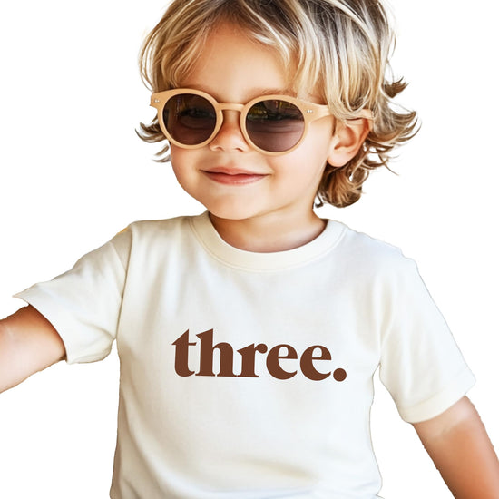 Toddler girl wearing Three period birthday shirt casual pose