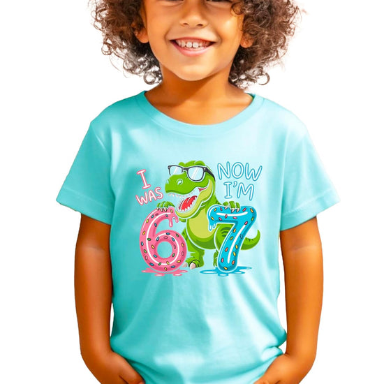 Size chart and color options for I Was 6 Now I'm 7 dinosaur birthday kids shirt