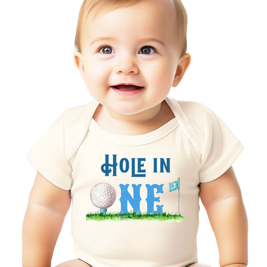 Natural colored baby snap bodysuit with golf-themed first birthday graphic design