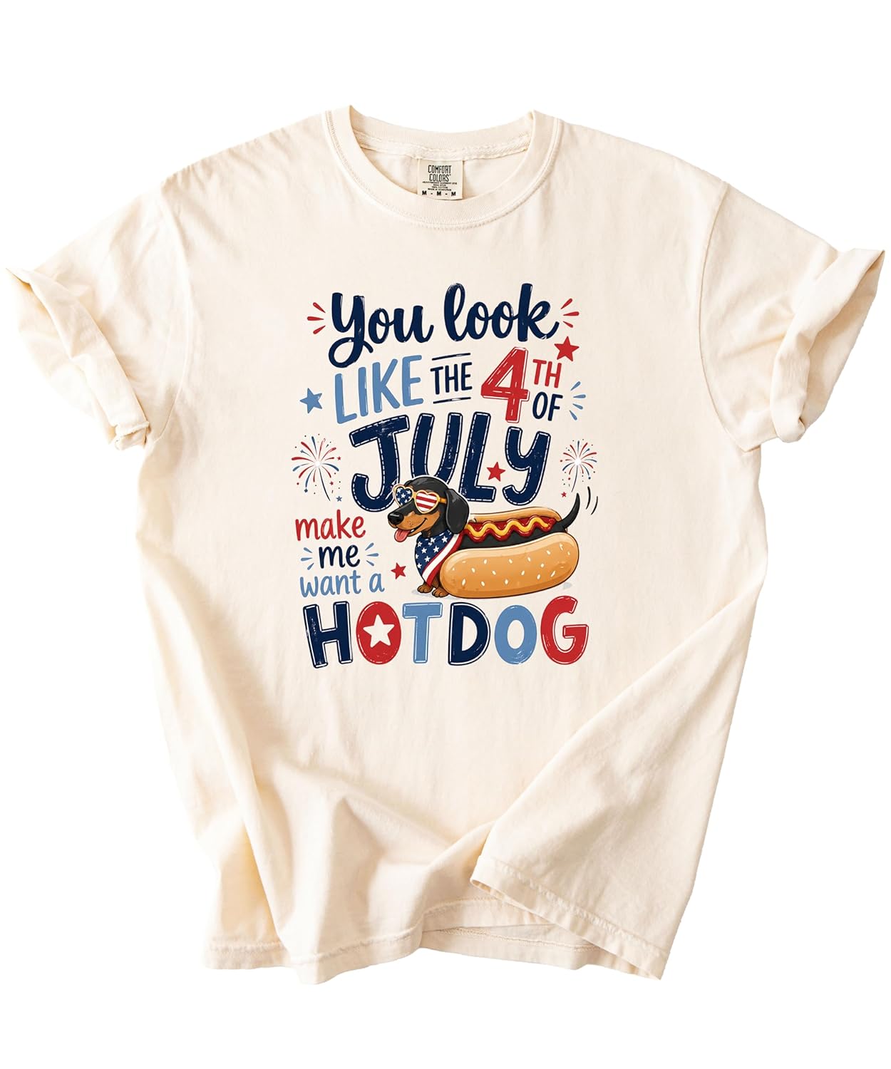 Close-up of dachshund wearing sunglasses in hot dog bun with American flag design and fireworks