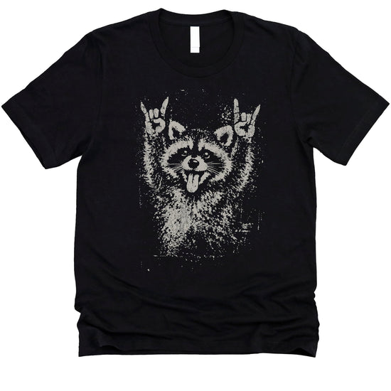 Funny punk raccoon shirt mockup showing retro-style raccoon with rock horns gesture on comfortable cotton tee