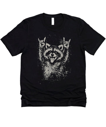 Funny punk raccoon shirt mockup showing retro-style raccoon with rock horns gesture on comfortable cotton tee