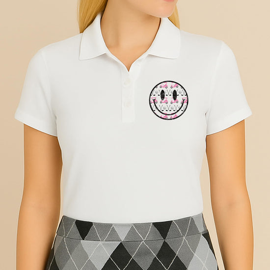 Detail shot of golf polo shirt collar and pink golf cart graphic