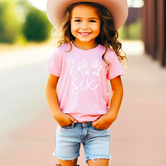 Back view of toddler girls birthday shirt showing fabric texture and fit