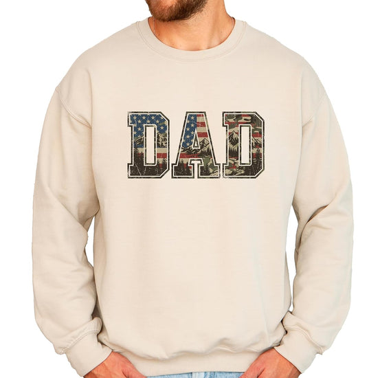 Close-up of varsity-style DAD lettering filled with distressed American flag and mountain landscape