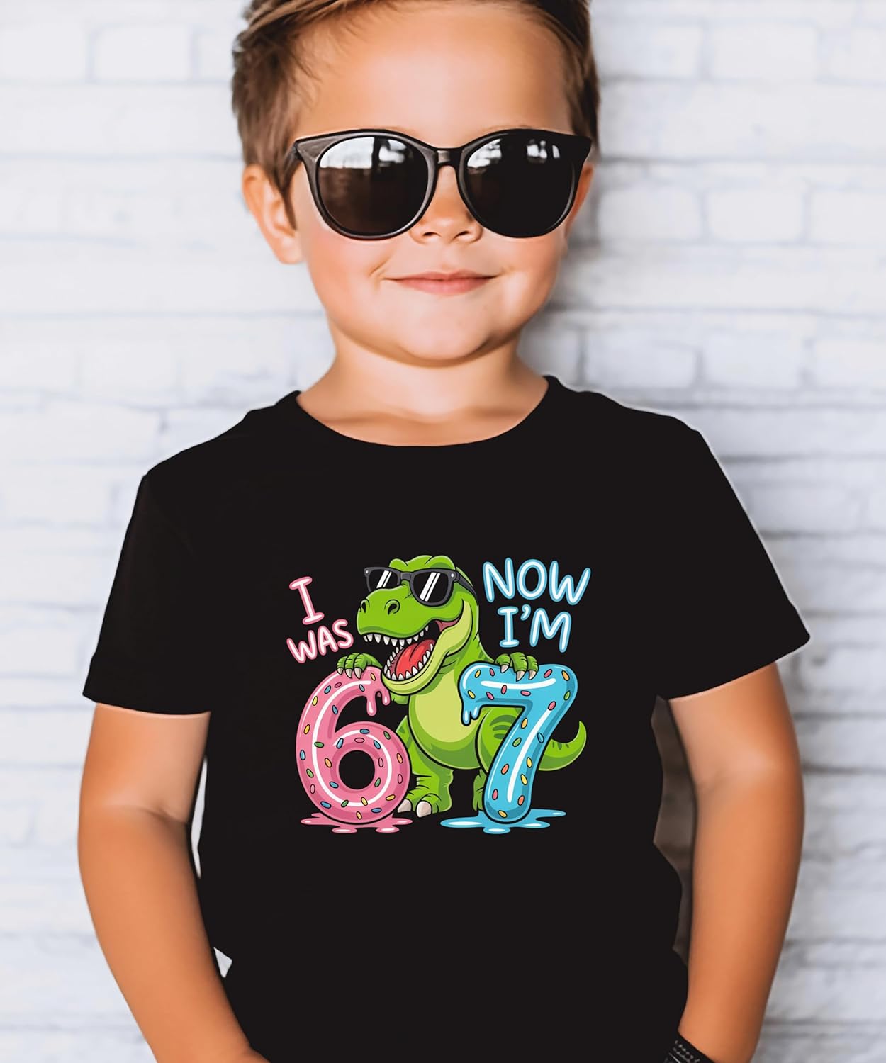 Kids dinosaur birthday shirt flat lay showing full T-Rex design and colorful lettering