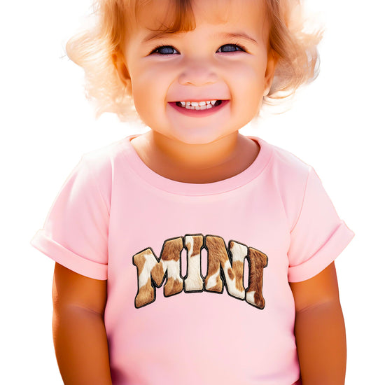 Product details and care instructions for cow print matching shirts