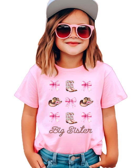 Western big sister tee with boots hats and bows graphic displayed on product model