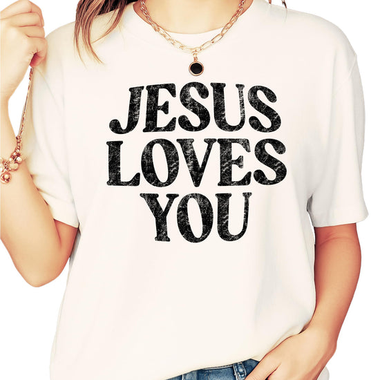 Close-up detail of Jesus Loves You distressed text design on blue jean colored shirt