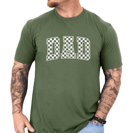 Side angle view of checkered DAD men's graphic t-shirt showing fit and style