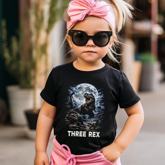 Three Rex dinosaur birthday shirt laid flat showing full graphic design