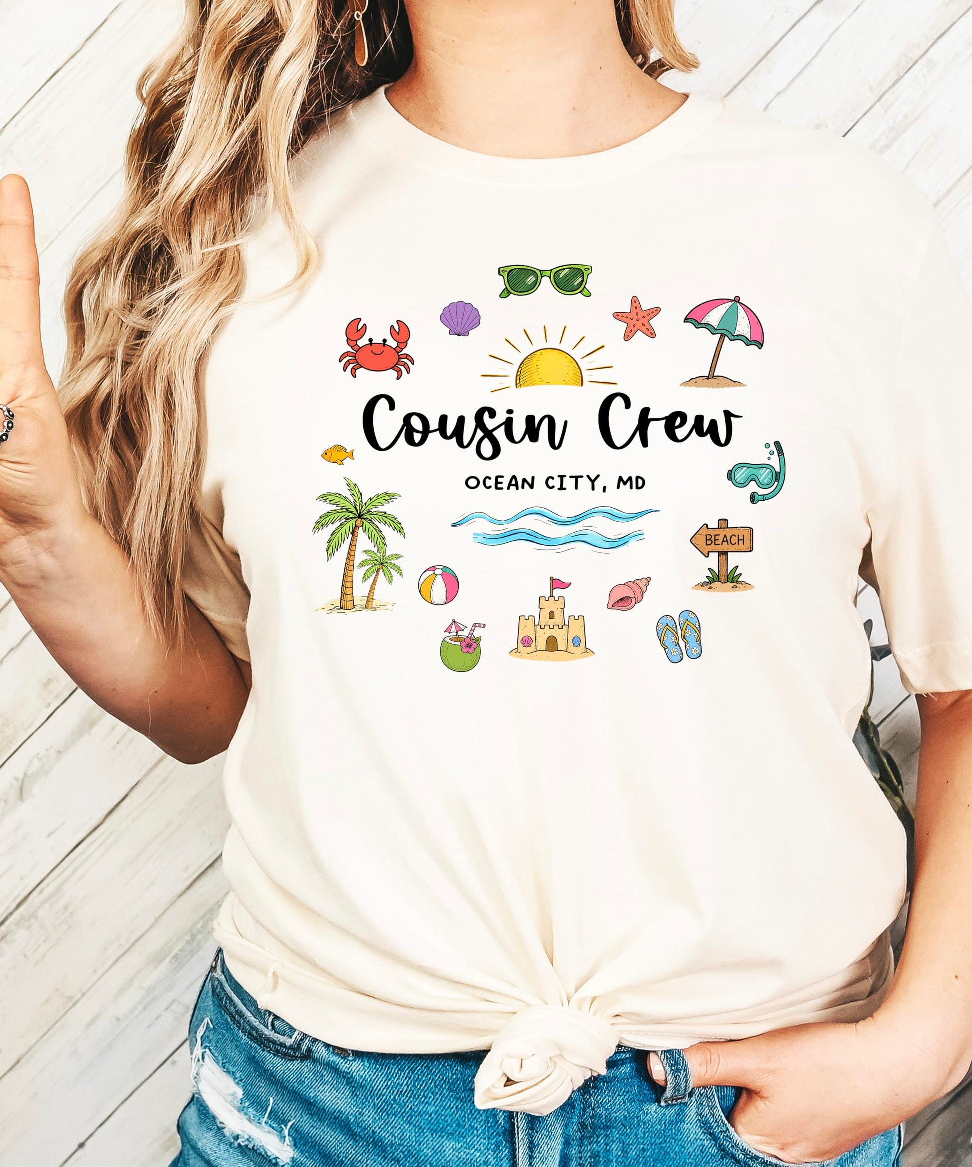 Ocean City MD family vacation shirt featuring playful beach graphics and Cousin Crew text