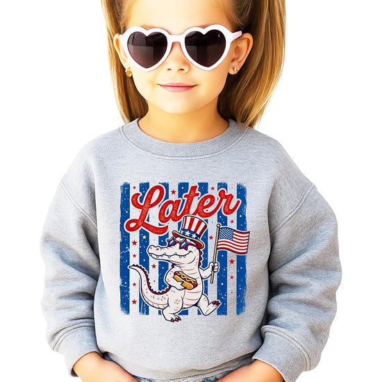 Later Gator sweatshirt design detail showing vintage-style American flag stripes and patriotic lettering