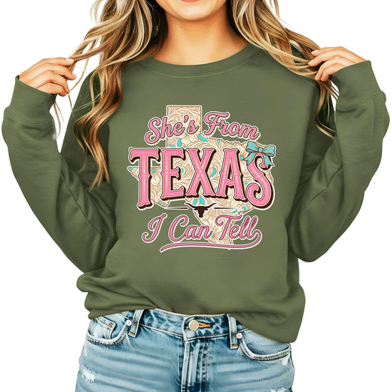 Army green sweatshirt with She's From Texas I Can Tell text and western cowgirl graphic design