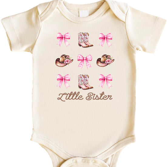 Pink baby bodysuit with Little Sister text and western cowgirl graphics including boots and hat