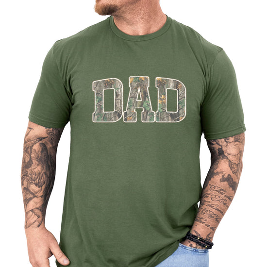 Dad camo graphic tee displayed on model showing fit and camouflage letter design