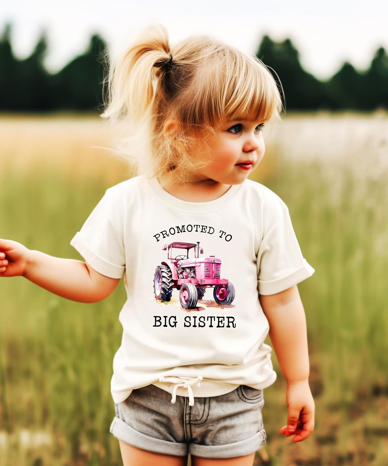 Big sister pink tractor shirt flat lay showing design details