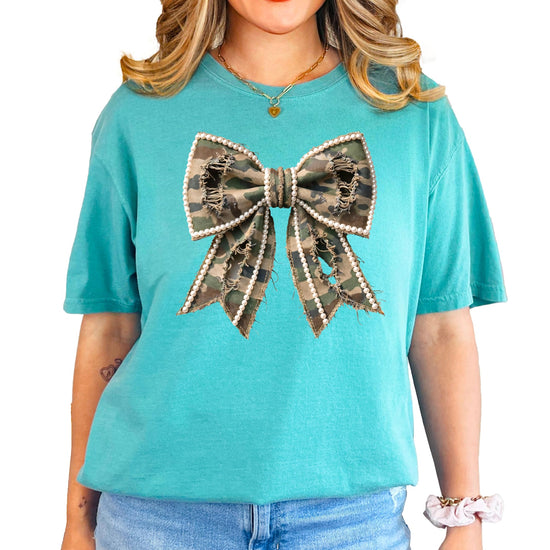 Full front view of women's blue denim shirt with camo pearls bow design