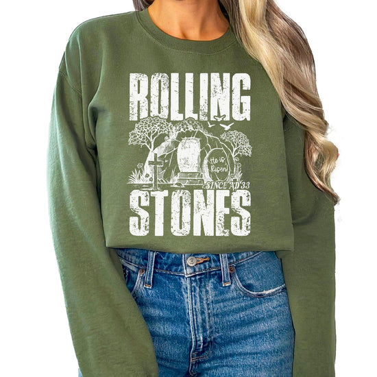 Army green He Is Risen Easter sweatshirt with Christian empty tomb graphic design on front