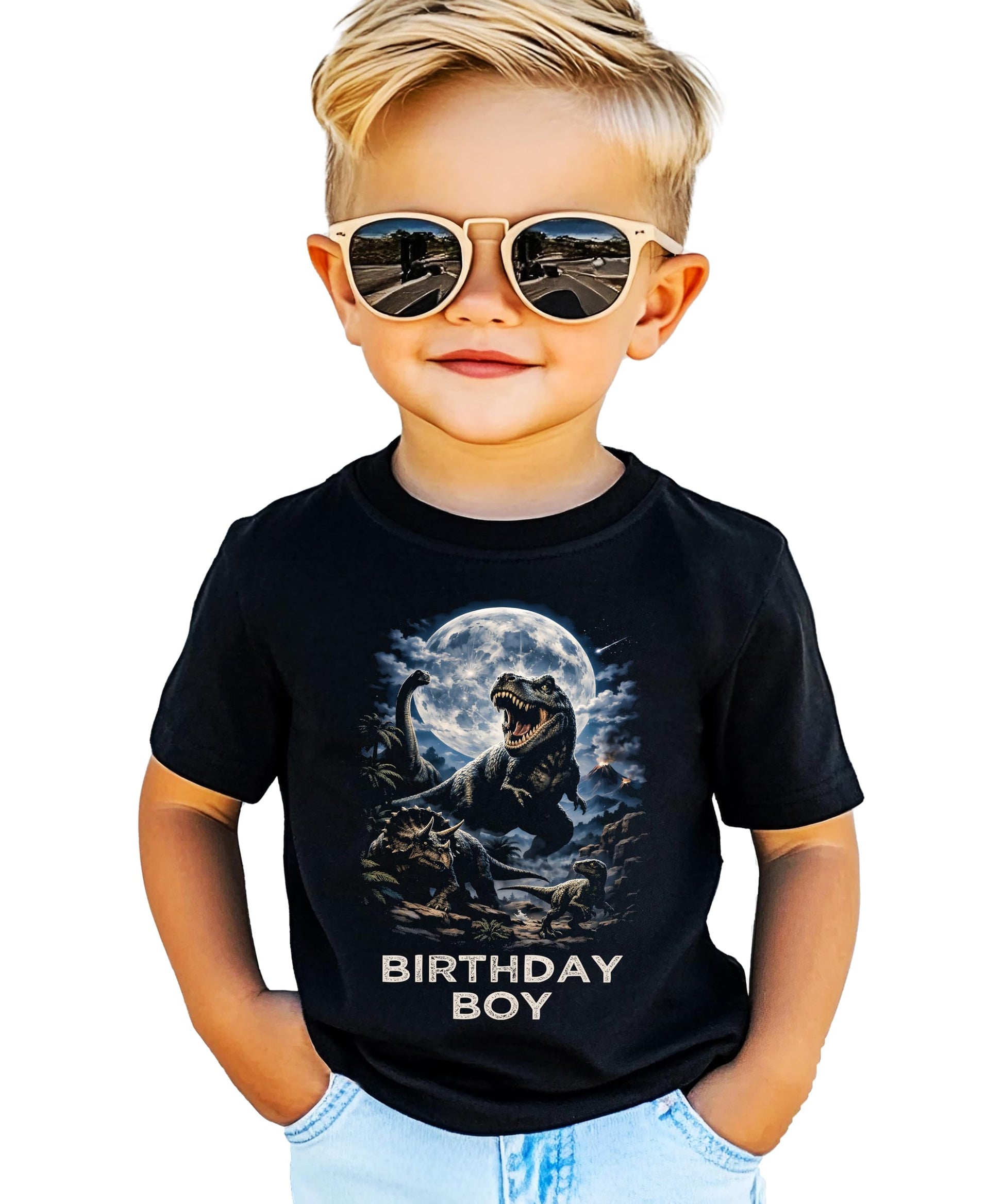 Birthday boy wearing black T-Rex dinosaur shirt for party celebration