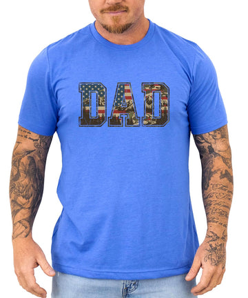 Natural colored patriotic dad t-shirt with DAD lettering filled with American flag and mountain camo design