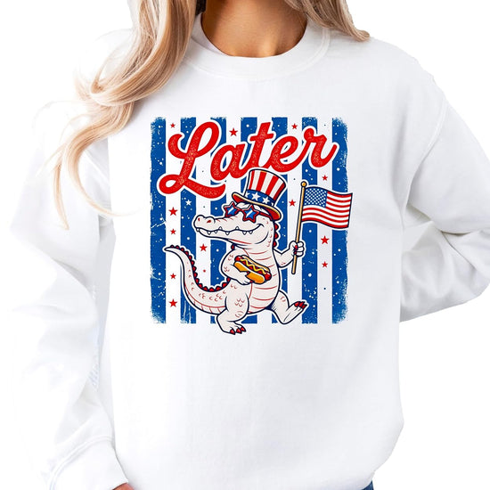 Multiple color options of Later Gator 4th of July sweatshirt in white and gray with alligator graphic