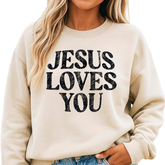 Side angle view of woman modeling Jesus Loves You faith sweatshirt