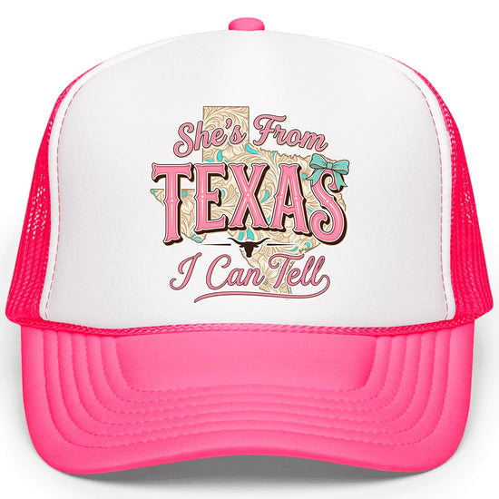 White trucker hat with pink She's From Texas script over tooled leather state silhouette design