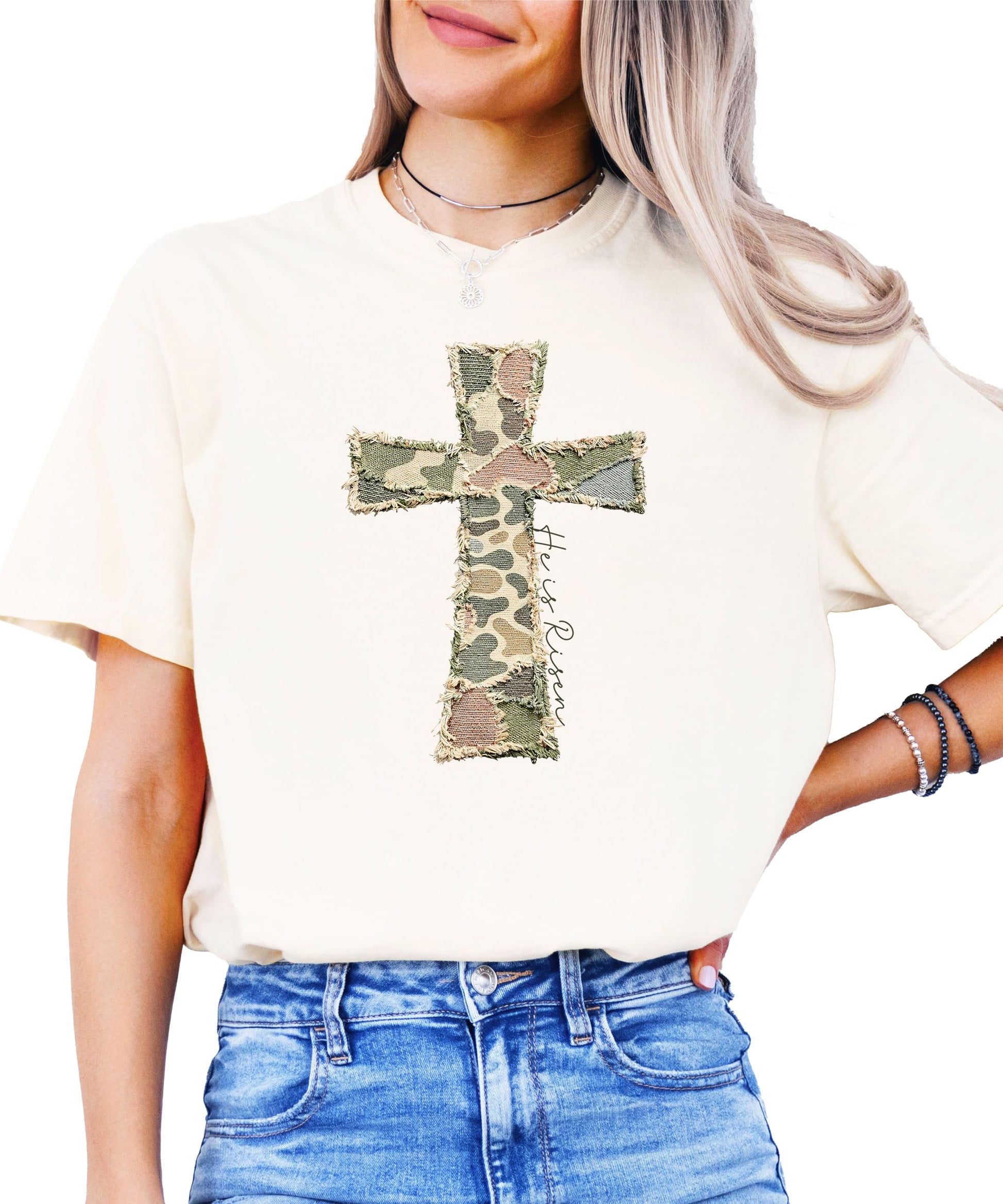 Detail shot of ink-printed He Is Risen text and cross graphic on blue fabric