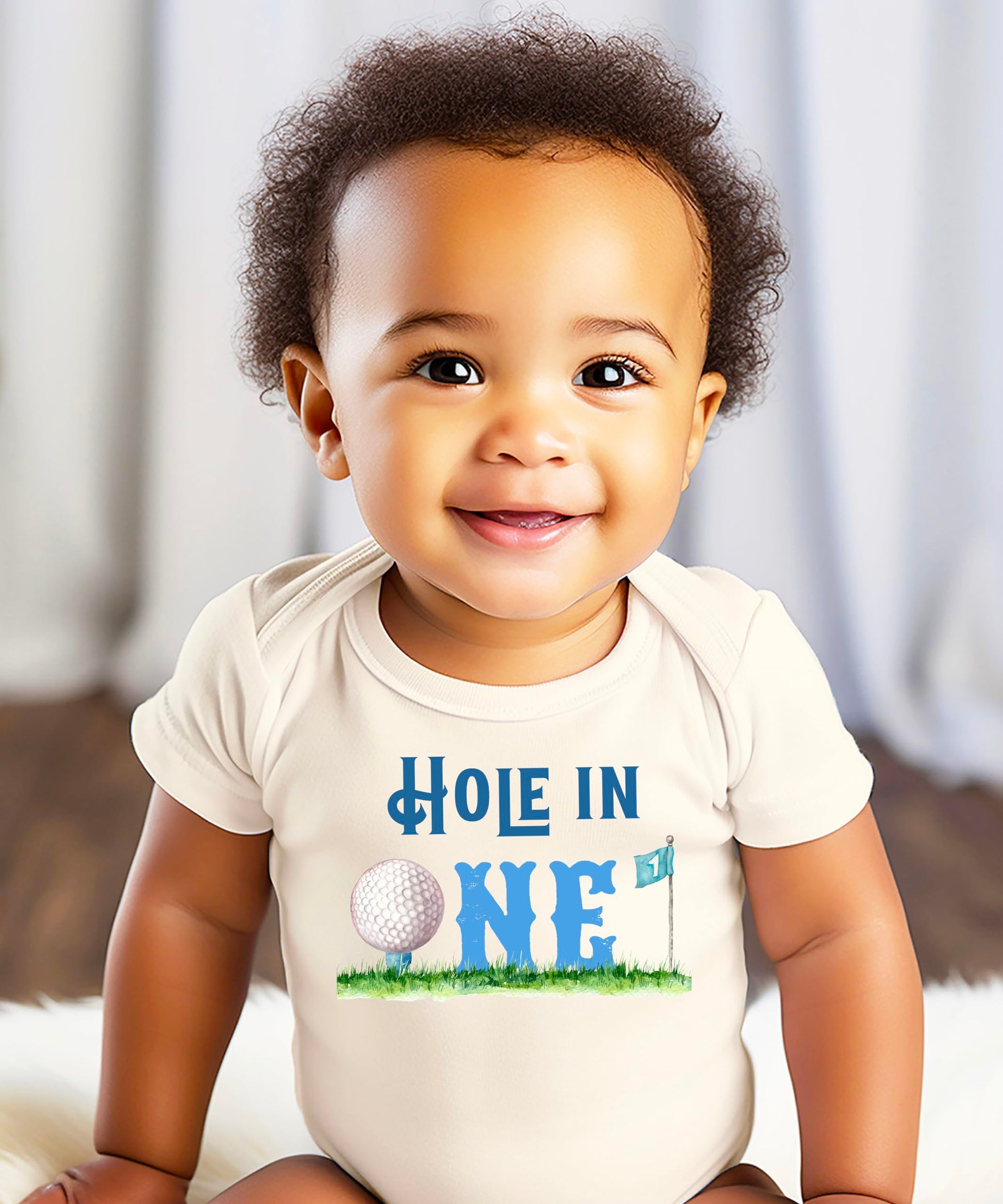 Baby bodysuit laid flat displaying full golf-themed birthday one-piece design