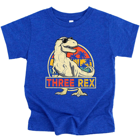 Toddler wearing black Three Rex 3rd birthday dinosaur shirt front view