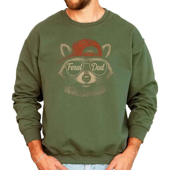 Close-up of Feral Dad raccoon design with sunglasses on black sweatshirt