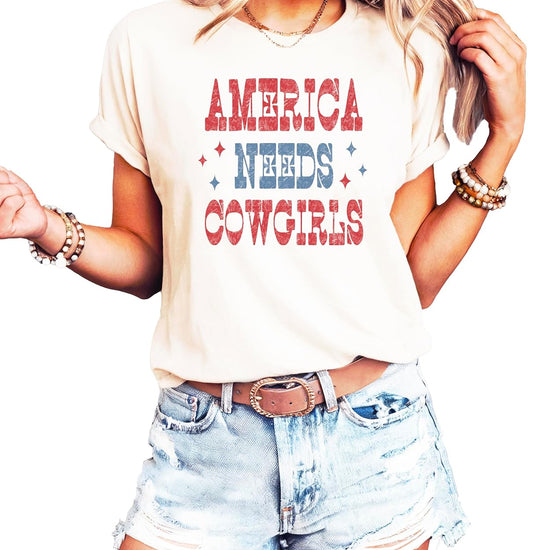 Woman wearing America Needs Cowgirls shirt with western style graphics