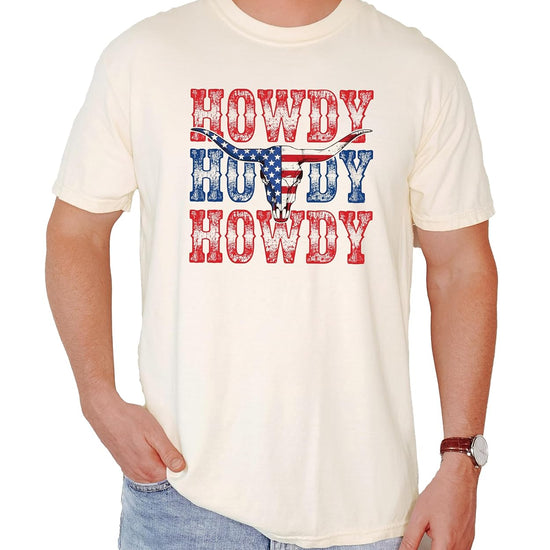 Close-up of distressed Howdy text and patriotic bull skull graphic on Western-style t-shirt