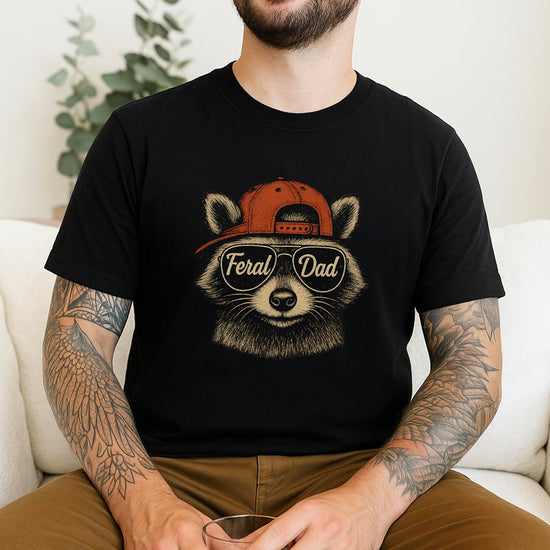 Man wearing Feral Dad raccoon graphic tee shirt showing fit and style
