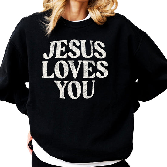 Woman wearing Jesus Loves You christian faith sweatshirt pullover