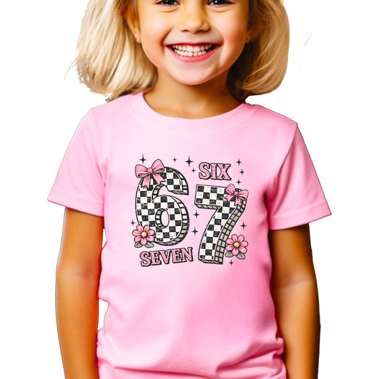 Girls seventh birthday shirt featuring coquette style pink bows and floral design
