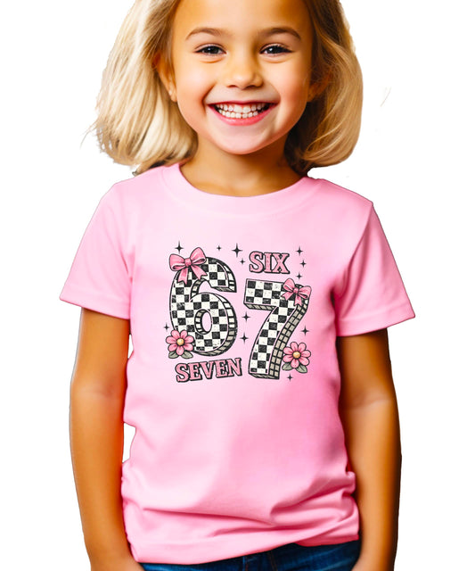 Girls seventh birthday shirt featuring coquette style pink bows and floral design