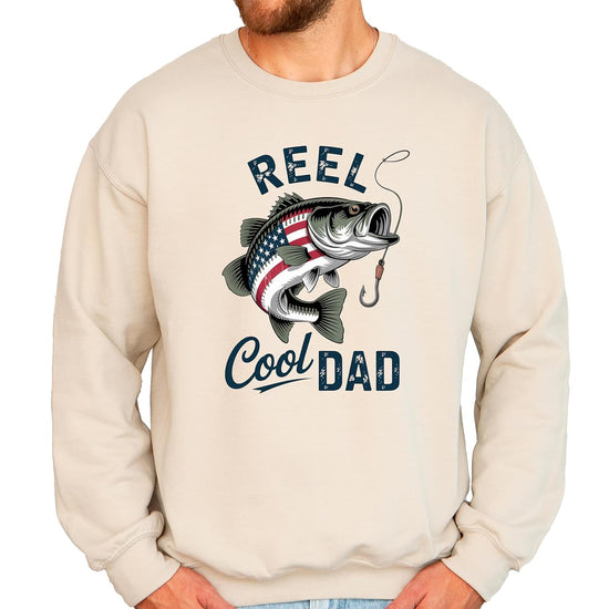 Close-up of vintage American flag bass fish graphic with Reel Cool Dad text on sweatshirt