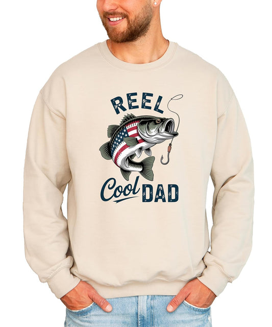 Close-up of vintage American flag bass fish graphic with Reel Cool Dad text on sweatshirt