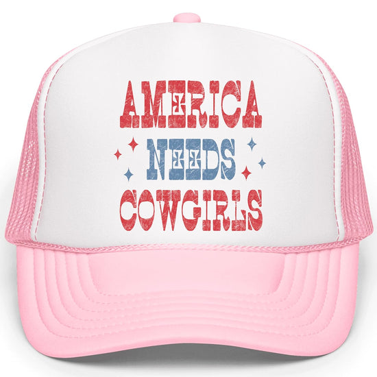 Close-up of America Needs Cowgirls hat typography showing distressed red lettering with blue accents and sparkle stars