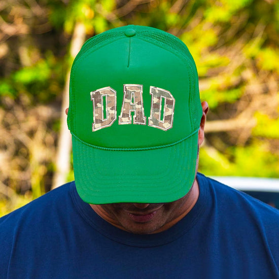 Back view of dad trucker hat showing breathable mesh panels and adjustable snapback