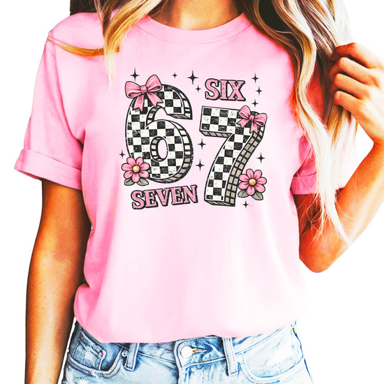 Close up of Six Seven checkered numbers with pink ribbon bows birthday shirt
