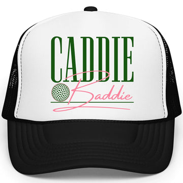 Caddie Baddie white and black trucker hat with green collegiate lettering and pink script on foam front panel
