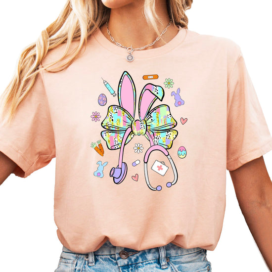 Close-up view of bunny bow stethoscope Easter graphic design on women's shirt