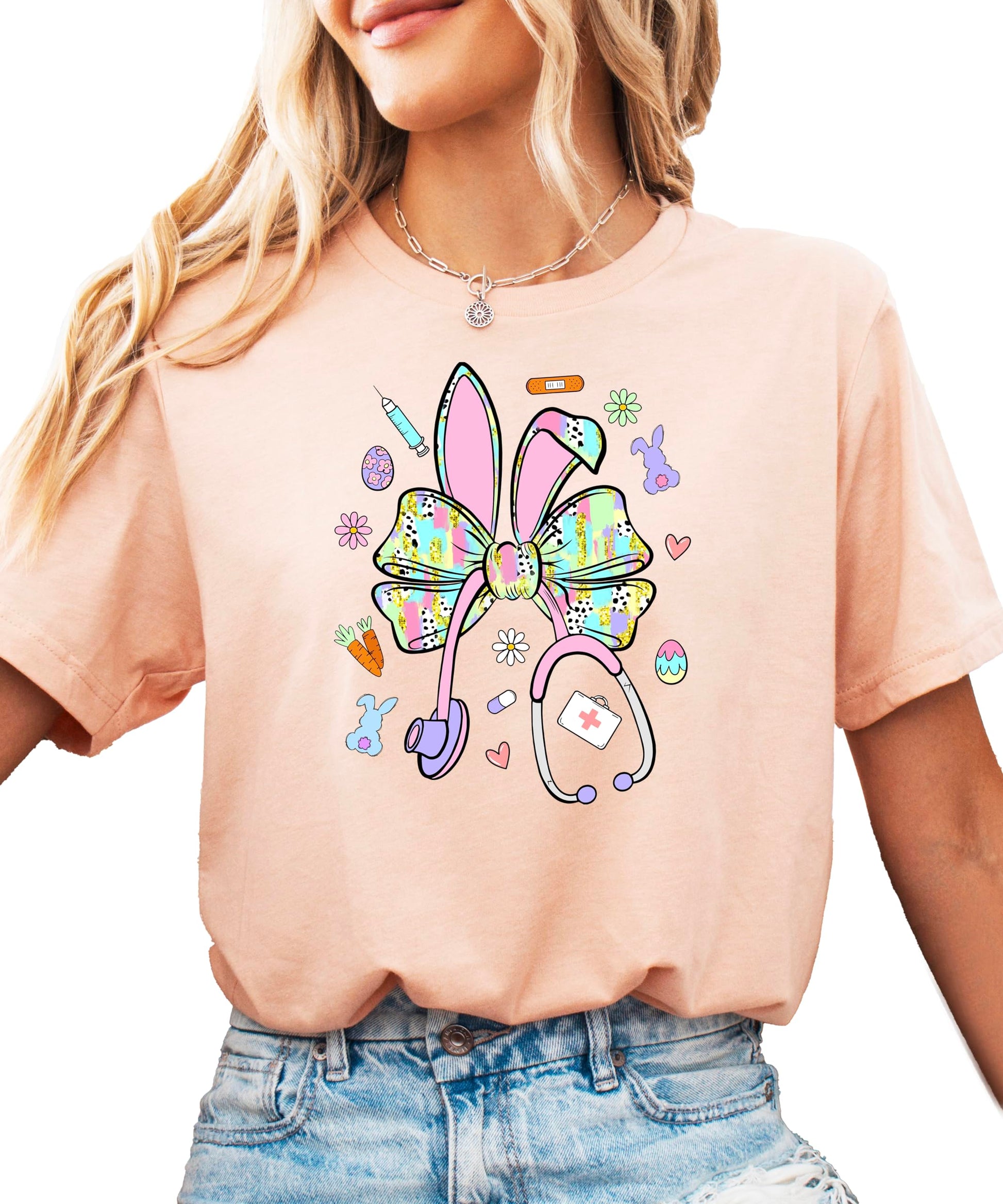 Close-up view of bunny bow stethoscope Easter graphic design on women's shirt